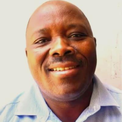 Headshot of Dr Josta Lameck Nzilano, Senior Lecturer at Dar es Salaam University College of Education